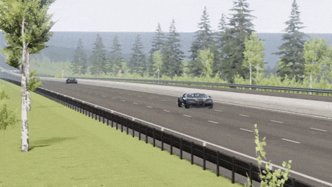 a car is driving down a highway with trees on the side