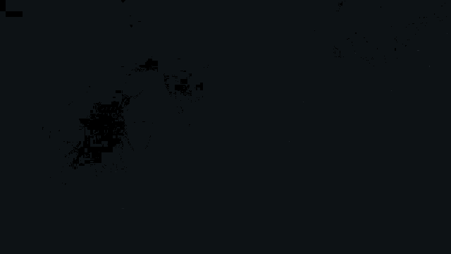 a man with long hair and a beard is smiling in the dark