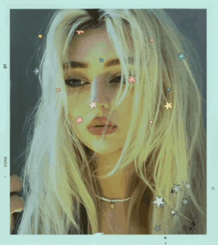 a picture of a woman with flowers in her hair has the number 67 on the bottom