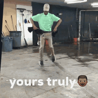 a man in a green shirt is dancing in a garage with the words yours truly written on the floor