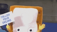 a stuffed animal of a marshmallow holding a sign that says `` follow your dreams '' .