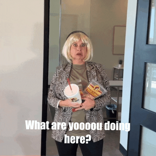 a woman in a snake print jacket is holding a drink and a bag of popcorn while asking what are you doing here