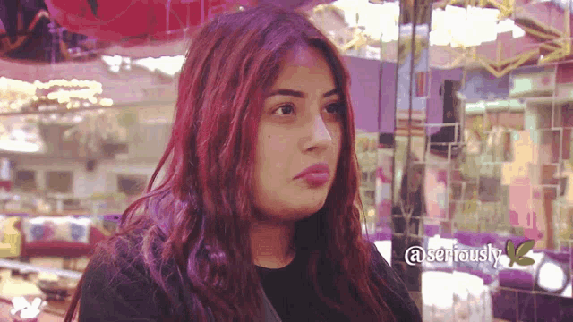 a close up of a woman 's face with the words seriously on the bottom right