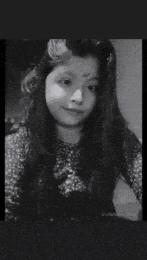 a black and white photo of a girl taken on 21/10/2021 at 20:55