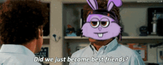 two men are talking to each other and one of them has a purple bunny mask on his head