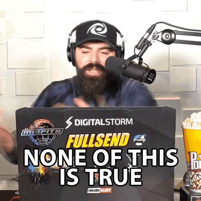 a man wearing headphones stands in front of a box that says digitalstorm fullsend none of this is true
