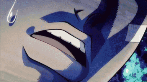 a close up of a person 's face with a tear coming out of their eye .