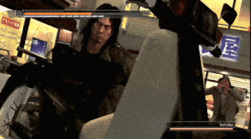 a video game screen shows a man holding a gun and the name yoshitaka at the bottom