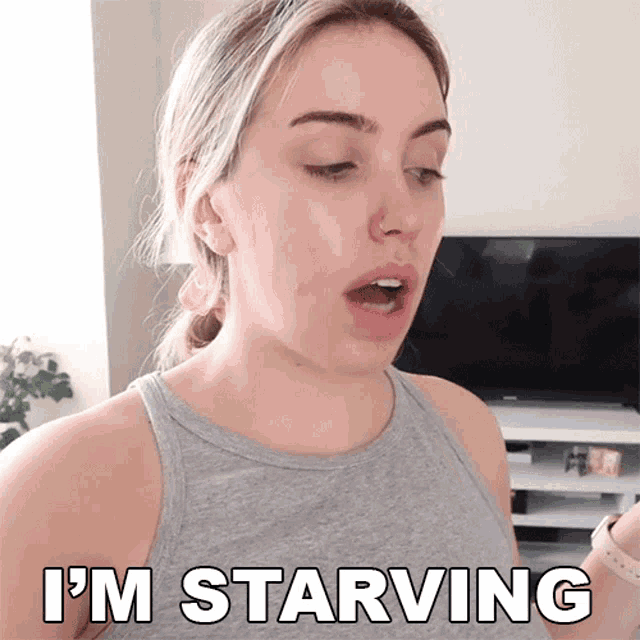 a woman says i 'm starving in front of a tv