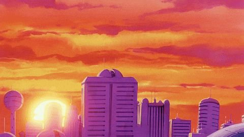 a sunset over a city with purple buildings