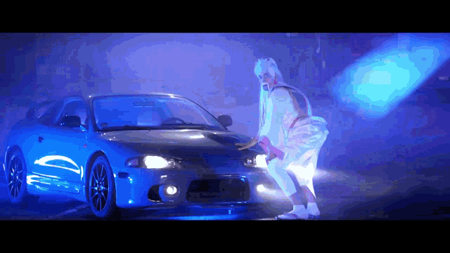 a person standing next to a blue car with a purple background