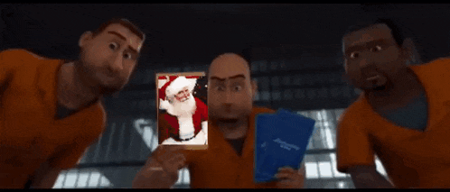 a group of men in orange shirts are holding a picture of santa claus .
