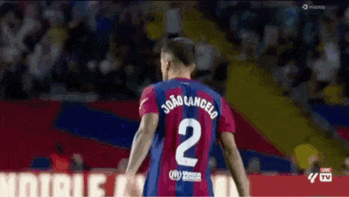 a soccer player with the name joao cancelo on his jersey