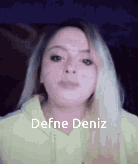 a close up of a woman with the name defne deniz on the bottom
