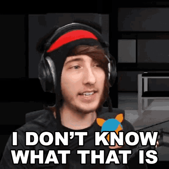 a man wearing headphones and a hat says i don 't know what that is