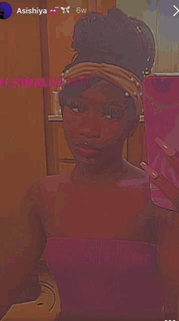 a woman is taking a picture of herself in a mirror with the name aishiya on the bottom right