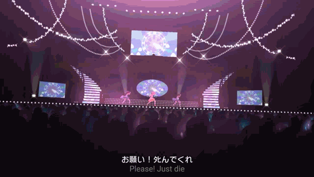 a purple stage with a sign that says please just die on it