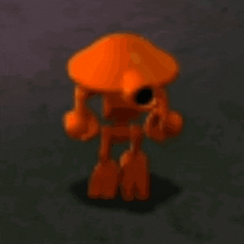 a blurred image of an orange cartoon character with a black hole in its head