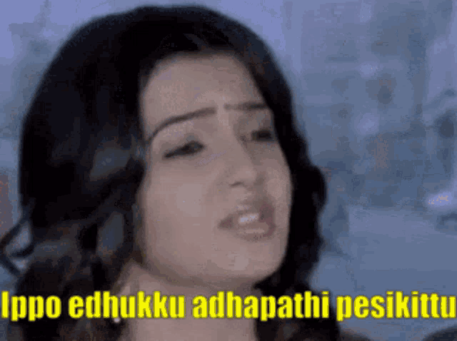 a close up of a woman 's face with a caption that says ippo edhukku adhapathi pesikatu .