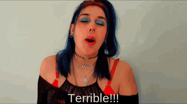 a woman with blue hair says terrible !!!