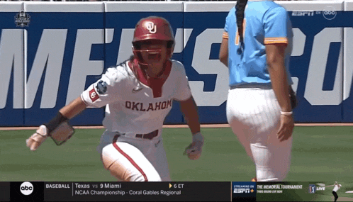 a female baseball player from oklahoma is celebrating a run