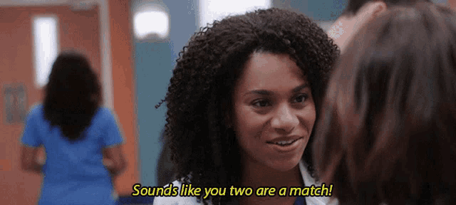 a woman with curly hair says " sounds like you two are a match " to another woman