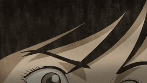 a close up of a person 's eyes with a slight smirk on their face
