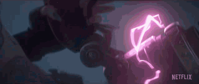 a purple lightning bolt is coming out of a machine .