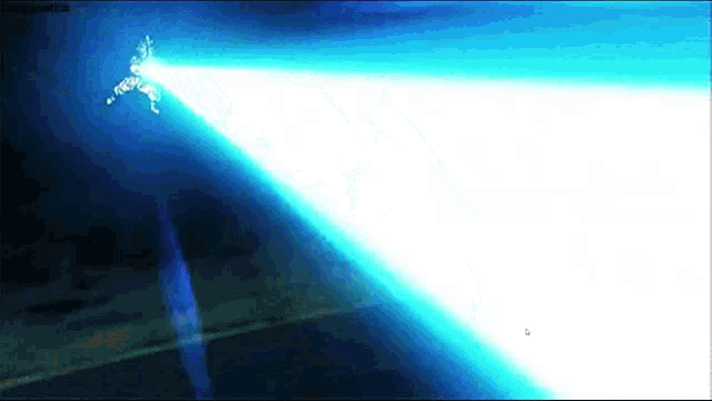 a person is flying through the air with a light coming out of their mouth
