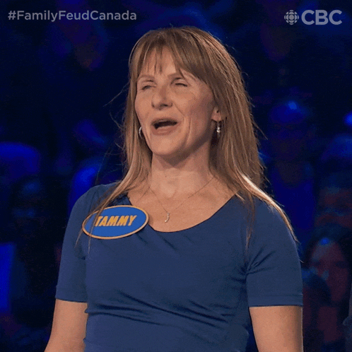a woman wearing a blue shirt with tammy written on it