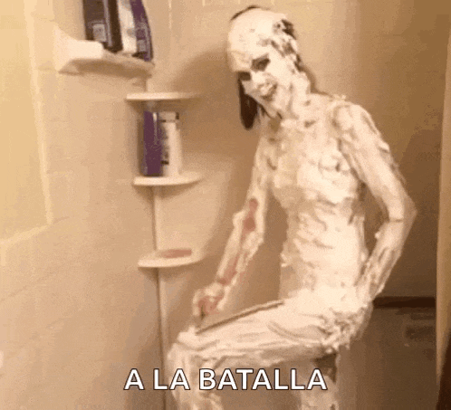 a woman is covered in shaving cream in a shower .