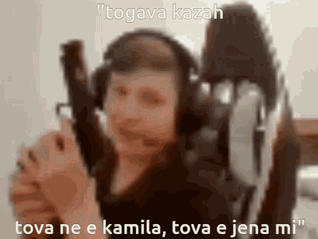 a blurry picture of a man holding a gun with the caption " togava kazan "