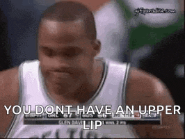 a basketball player is making a funny face and saying `` you dont have an upper lip '' during a game .