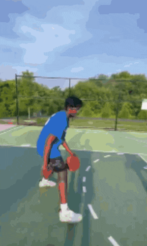 a man in a blue shirt is playing basketball on a court