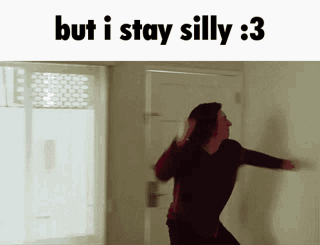 a woman is dancing in a room with the words but i stay silly : 3