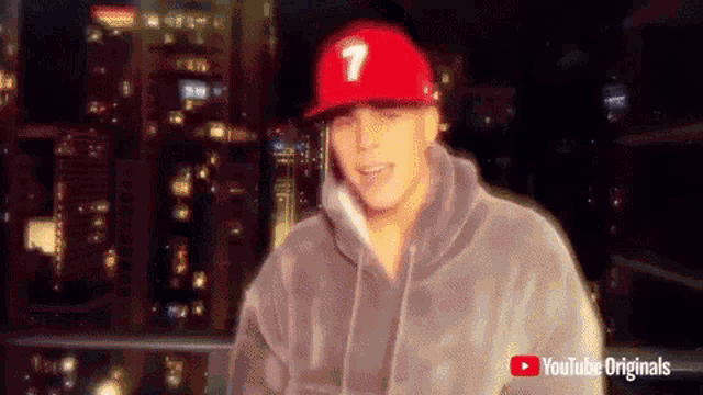 a man wearing a red hat with the number 1 on it