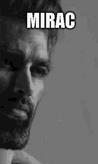 a black and white photo of a man with a beard and the word mirac written on his face .