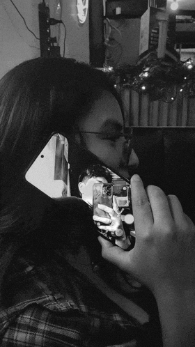 a woman taking a picture of herself in a mirror
