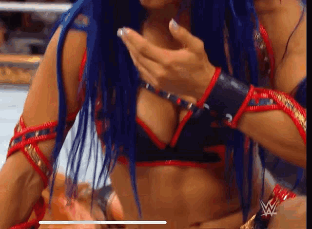 a close up of a woman 's chest with a w logo on the bottom