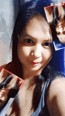 a woman is taking a selfie with a capcut watermark on the bottom right