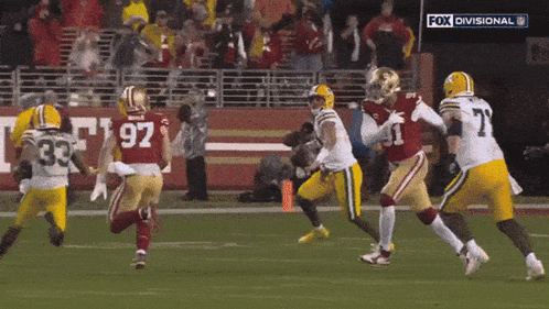 a football game between the 49ers and green bay packers