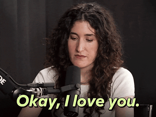 a woman says okay i love you in front of a rode microphone