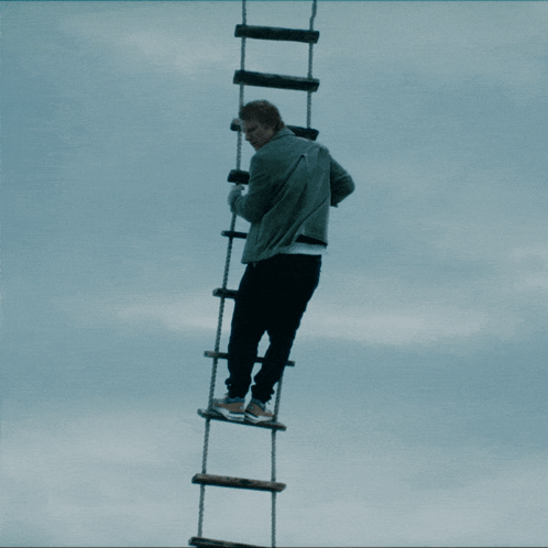 Climbing The Rope Ladder Ed Sheeran GIF - Climbing The Rope Ladder Ed Sheeran Going Up GIFs
