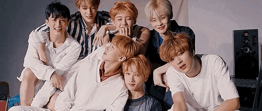 a group of young men are posing for a picture together