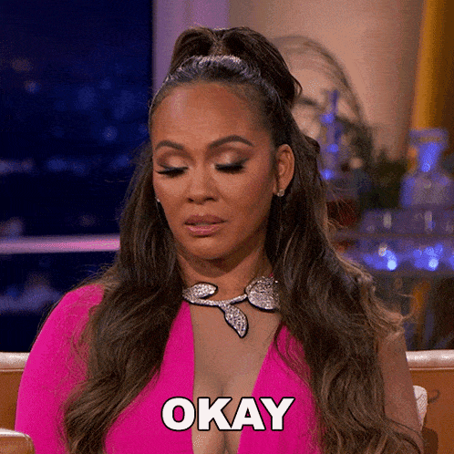 a woman in a pink dress has the word okay on her face