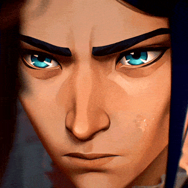 a close up of a man 's face with blue eyes and black eyebrows
