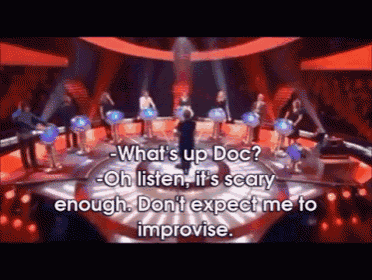 a group of people on a stage with the words " what 's up doc " on the bottom