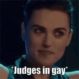 a close up of a woman 's face with the words `` judges in gay '' written below her .