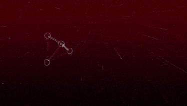 a bunch of geometric shapes are floating in the air on a red background
