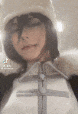 a tiktok video of a person wearing a hat and a jacket